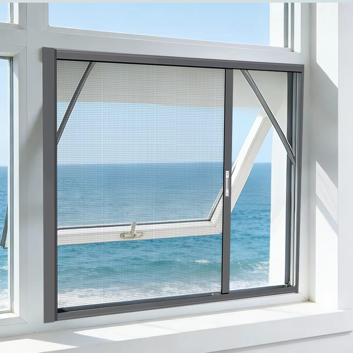 A dark gray automatic retractable window screen roller with a mesh screen, shown partially open on a white window frame with an ocean view outside. Chinese promotional text is displayed at the top.